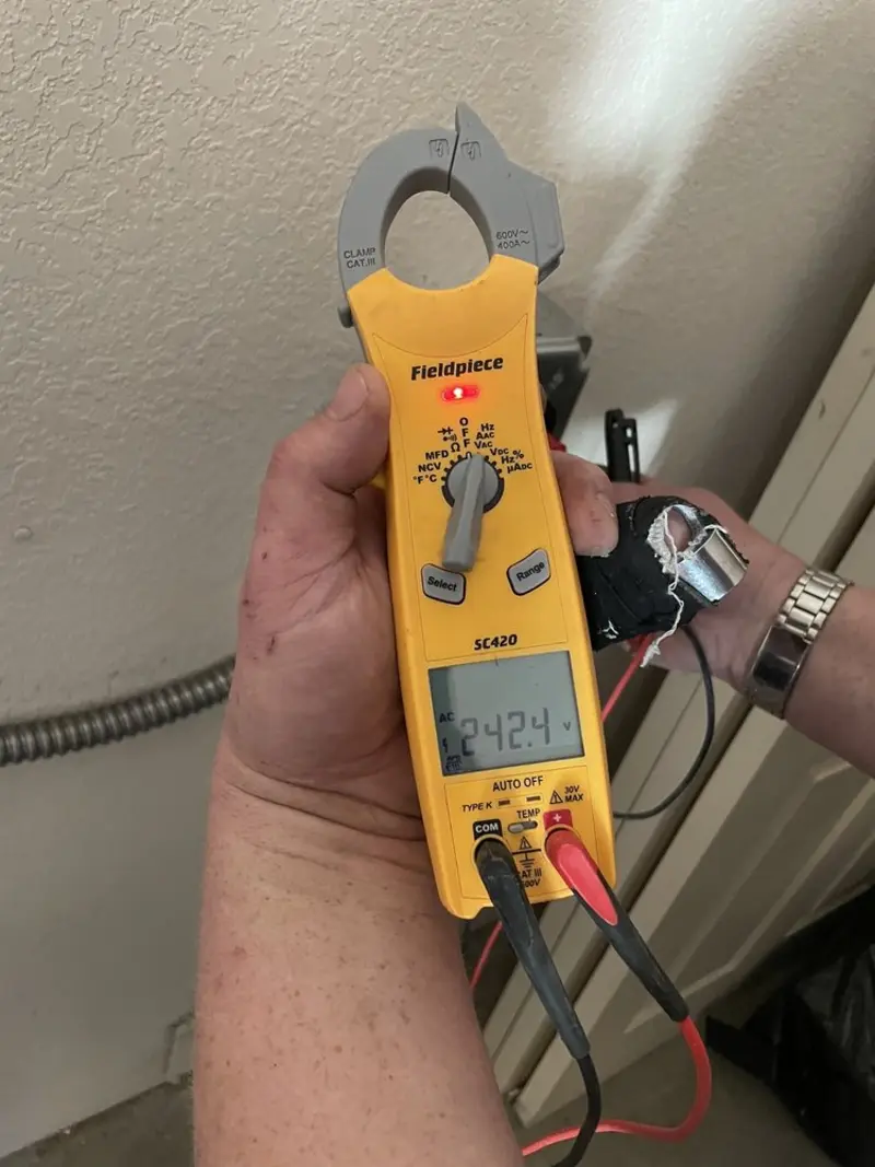 Voltage testing with clamp meter during Whole House Surge Protector in Darnestown